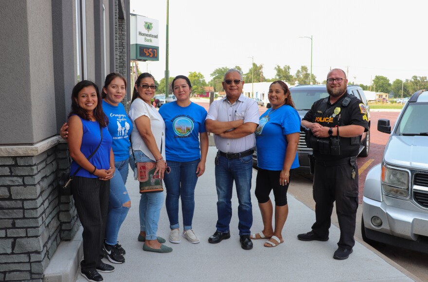Members of Corazones Azules stand in front of the Heartland Workers Center’s office in Schuyler. From left to right: Rosa Pinto Barba, Evelyn Trejo, Roxana Lucar, Rosa Baeza, Luis Lucar, Liduvina Perez Ozuna and Sgt. Cheyne Terrell.