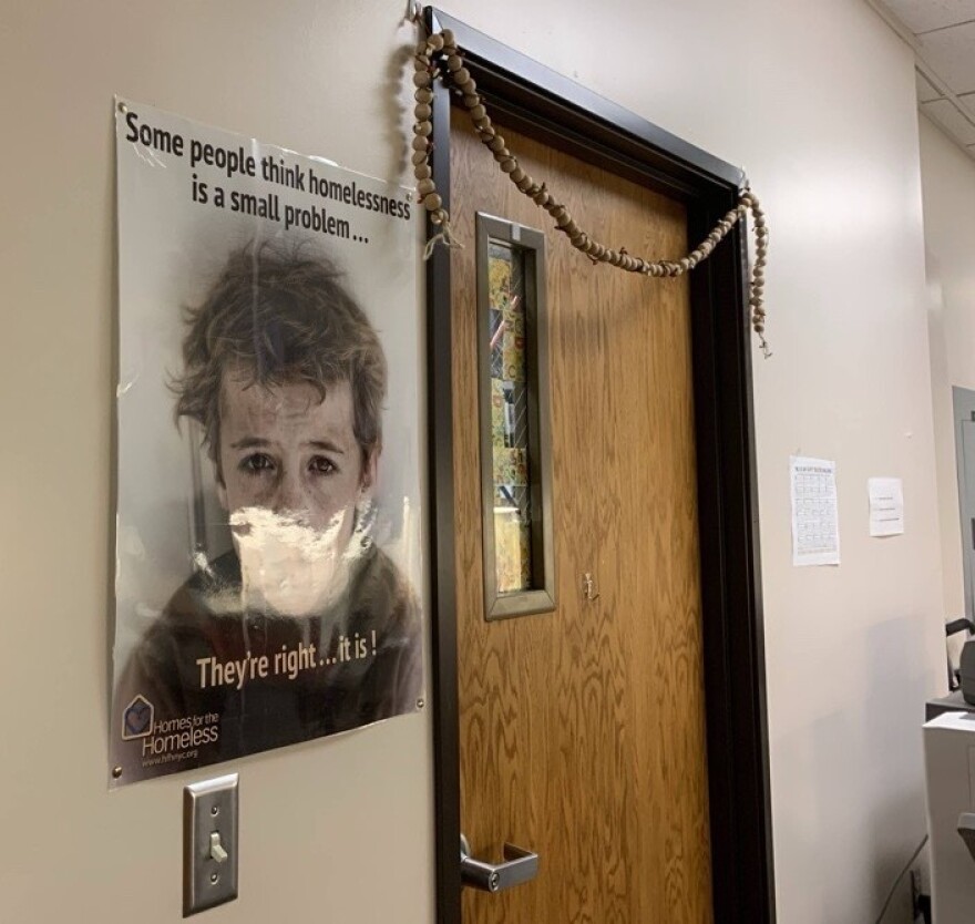 A poster about homelessness hangs outside Kristi O’Meara's door. The McKinney-Vento liaison for Lexington Public Schools since 2008, O'Meara has offices in both the middle and high school.