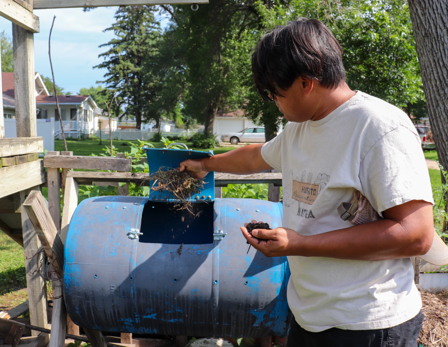 Lopes uses compost to fertilize the 16 species of tomatoes growing in his garden.