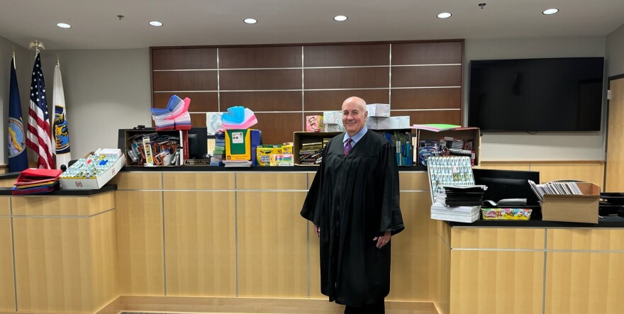 Judge Chris Kopecky of the Lawrence, Kansas Municipal Court presides over a growing stock of new school supplies to be distributed to families for the 2024-25 academic year.