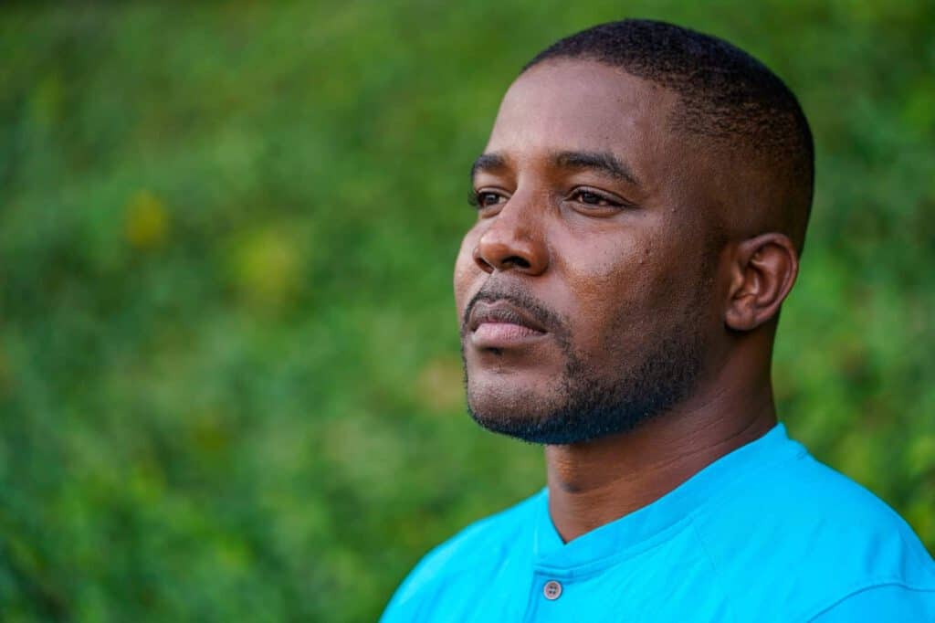 Man contemplating immigration detention policy changes in Illinois.