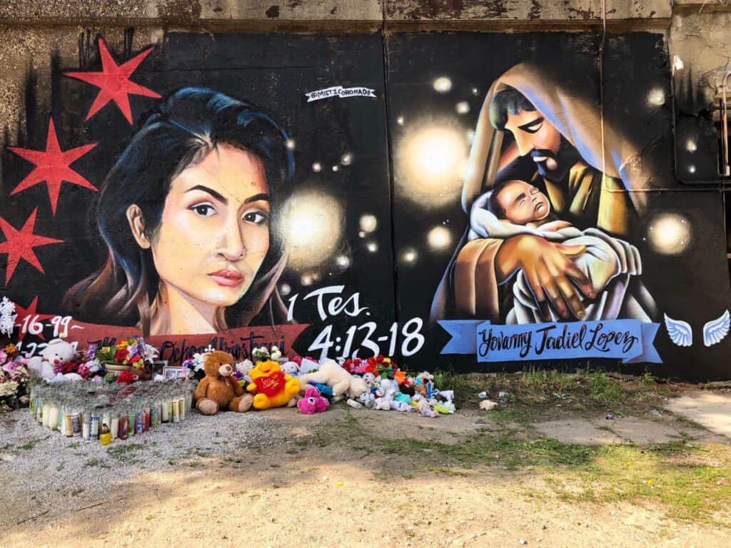 Mural depicting a woman and a nativity scene, symbolizing hope and activism in Chicago.