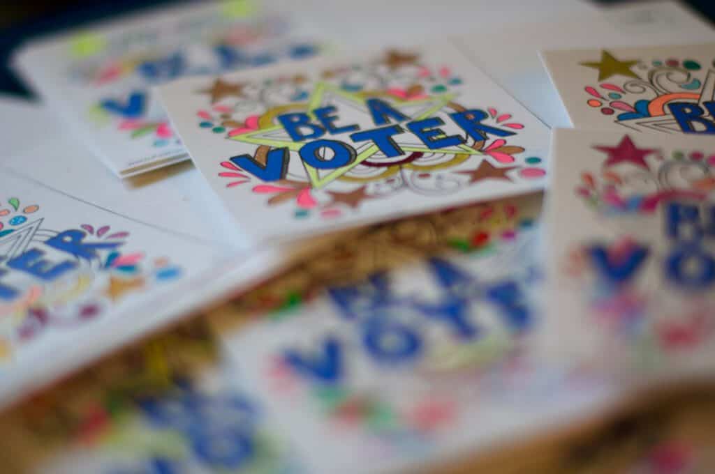 Vote stickers with colorful designs for election awareness and civic participation.