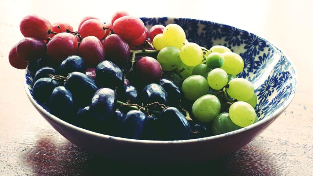 Colorful grapes in a decorative bowl celebrating New Year’s Eve, Latino-Style.