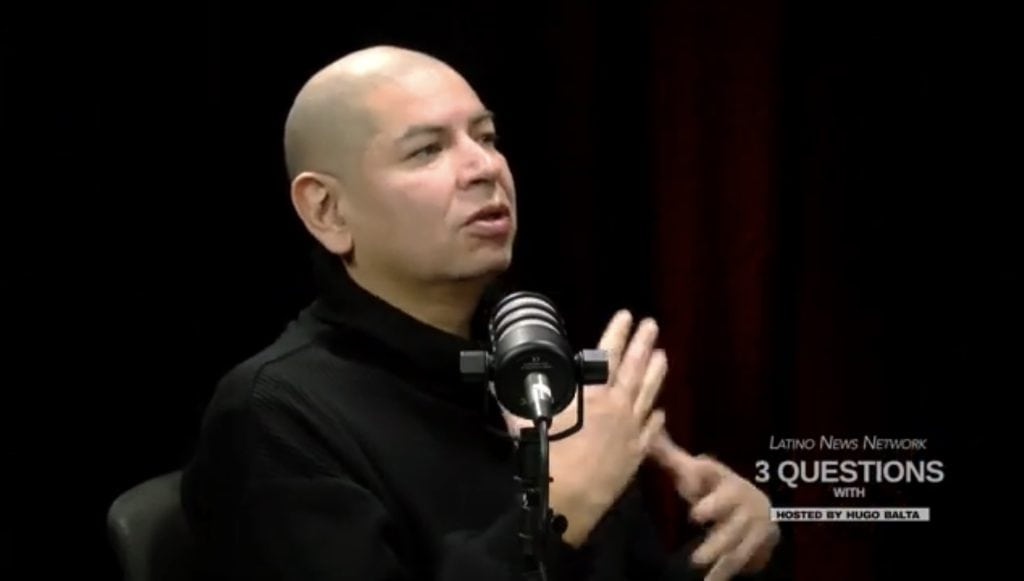 Curiosity and joy in Carlos Matallana during an interview on Latino News Network.