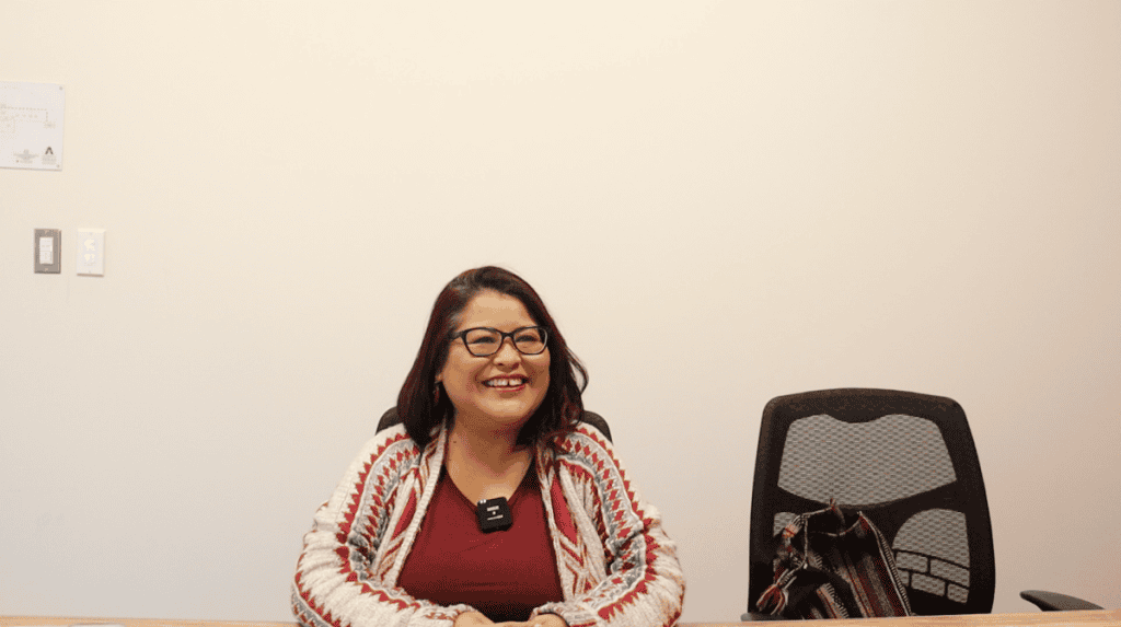 A woman smiling during a civic engagement event in Arlington.