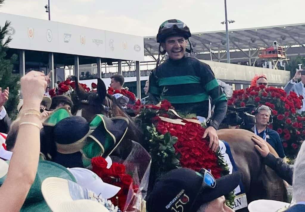 Jockey Brian Hernandez Jr. celebrates victory at the Kentucky Derby 2024.