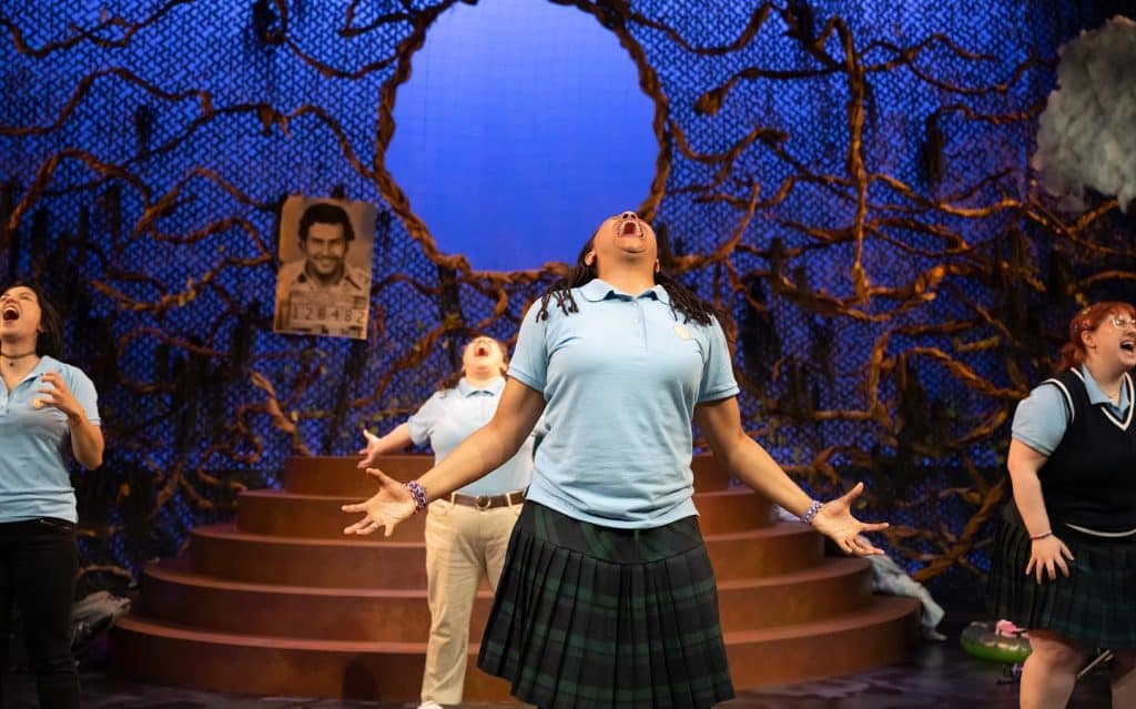 Students performing a Spanish-language play on stage in Seattle.