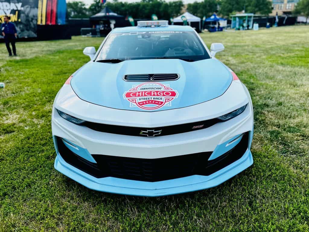 Chevrolet race car with NASCAR Daniel’s Amigos logo at Chicago event.