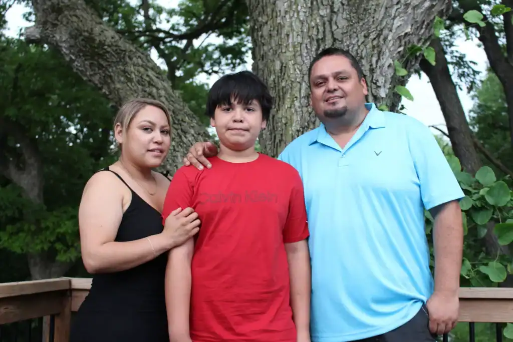 Kansas City Chiefs rally shooting survivors with family outdoors after tragedy.