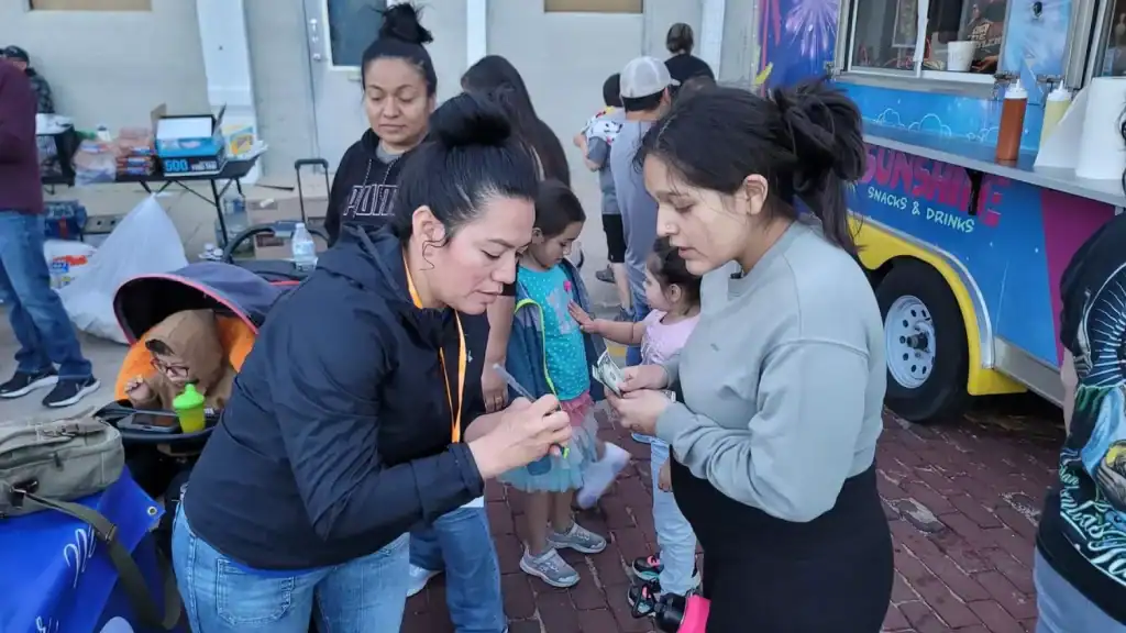 Accessible image of Latina mothers collaborating with local police in Nebraska to enhance safety for.