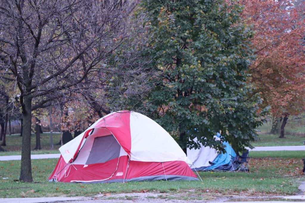 Temporary tents set up in a park to address Chicago's housing crisis.