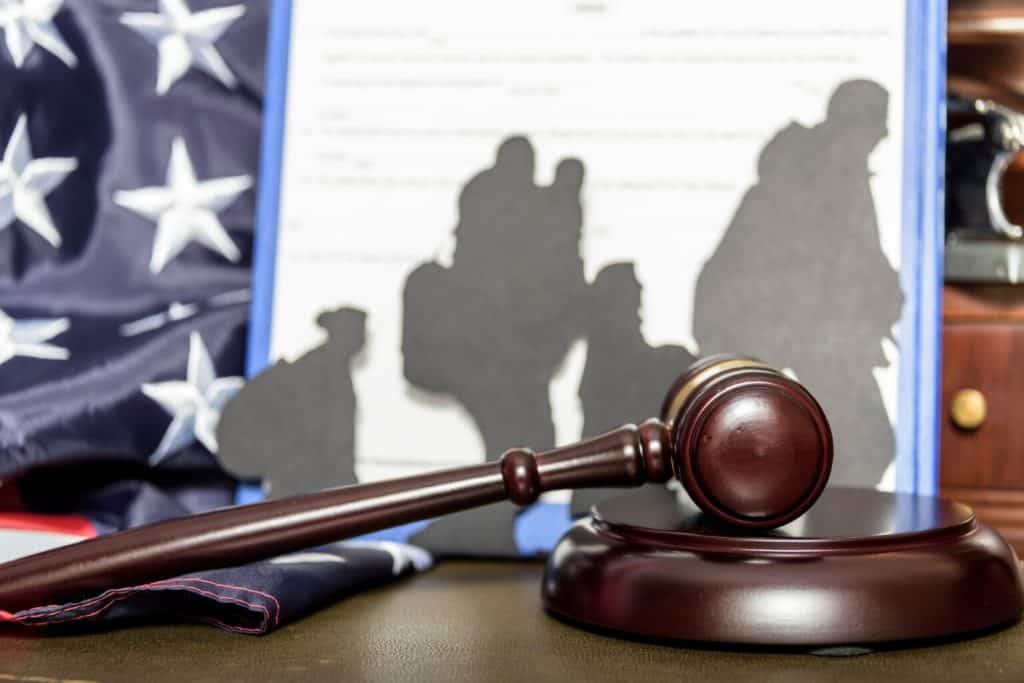 Gavel and American flag representing immigration law and advocacy efforts in Connecticut.
