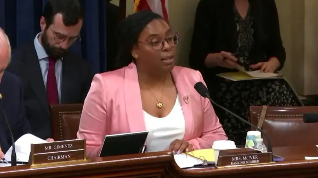 Cuban official speaking at a government meeting about Chinese investments.
