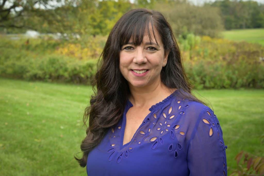Elizabeth Aranda advocating for immigrant rights and higher education support in Florida.