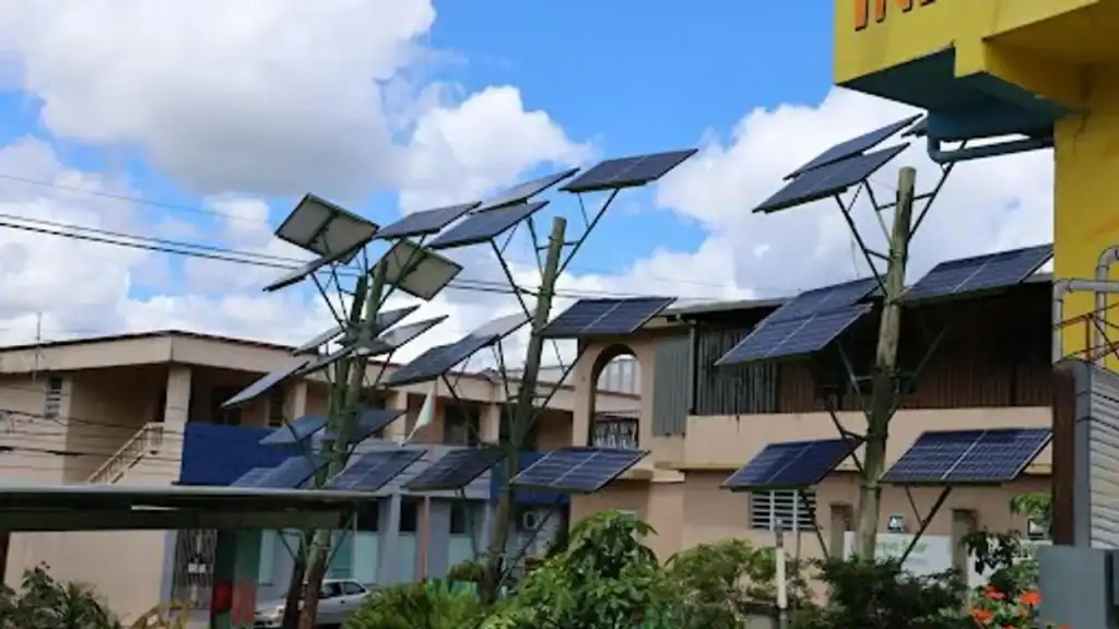 Solar panels installed on rooftops in rural Puerto Rico for sustainable energy solutions.