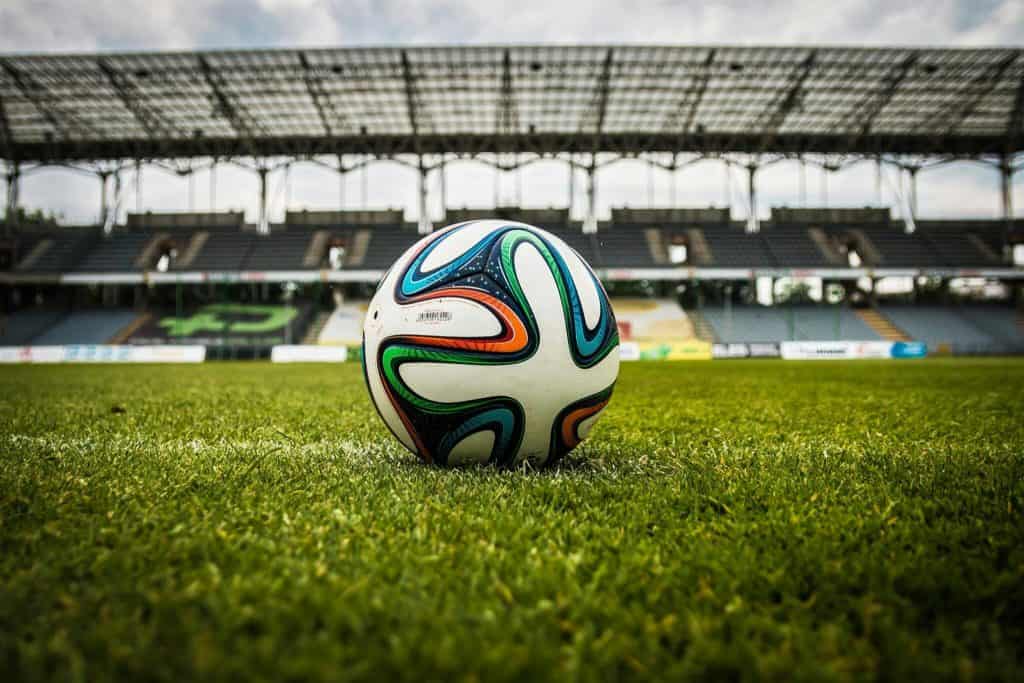 The FIFA World Cup soccer ball on a stadium field.