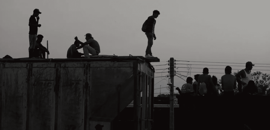 Deported family members on a rooftop seeking reunion, highlighting immigration struggles.