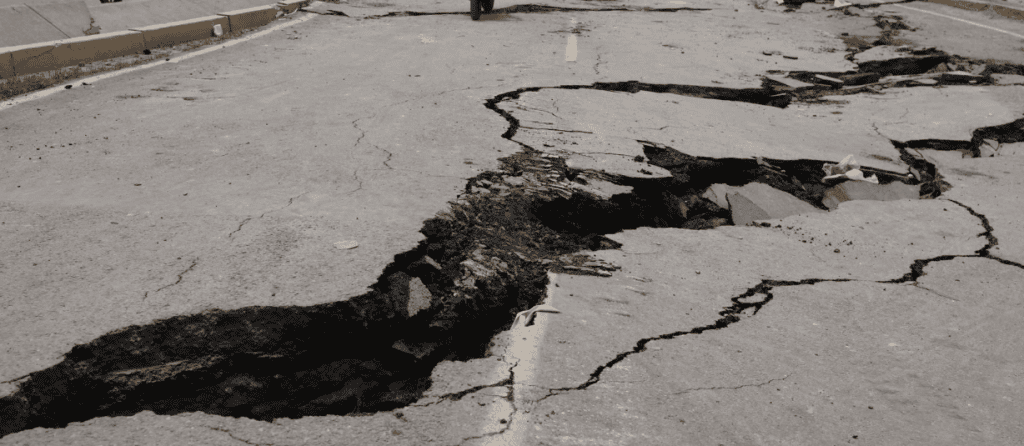 Severe earthquake damage with large cracks on the road surface in Venezuela.