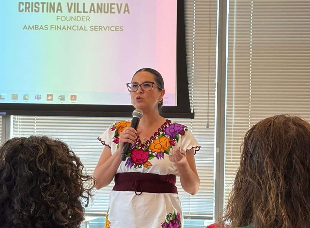 Cristina Villanueva speaking at a financial literacy event in Milwaukee.