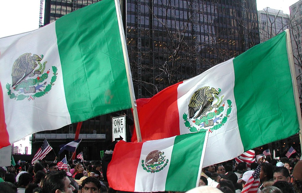 Mexican flags waved during rally against anti-immigration policies.