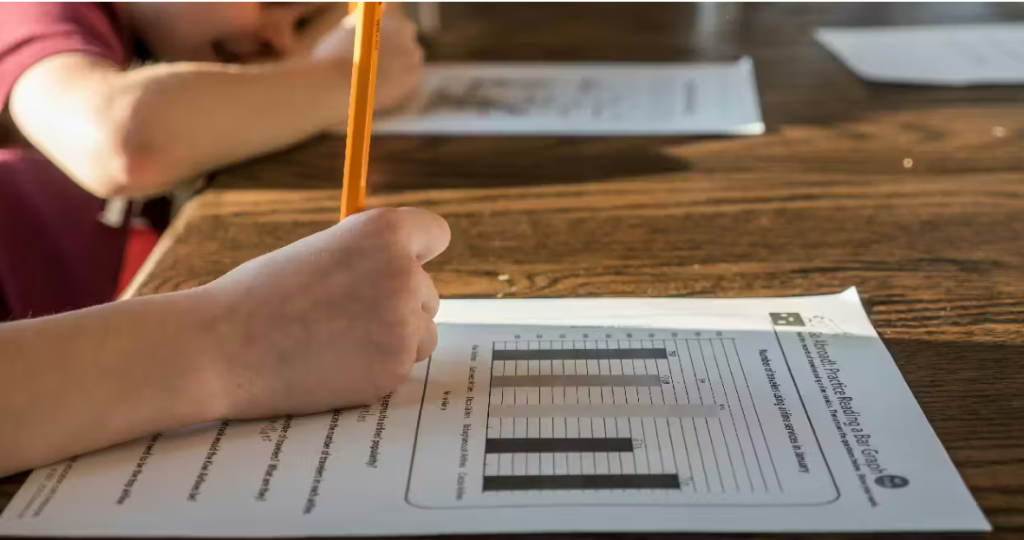 person writing on paper