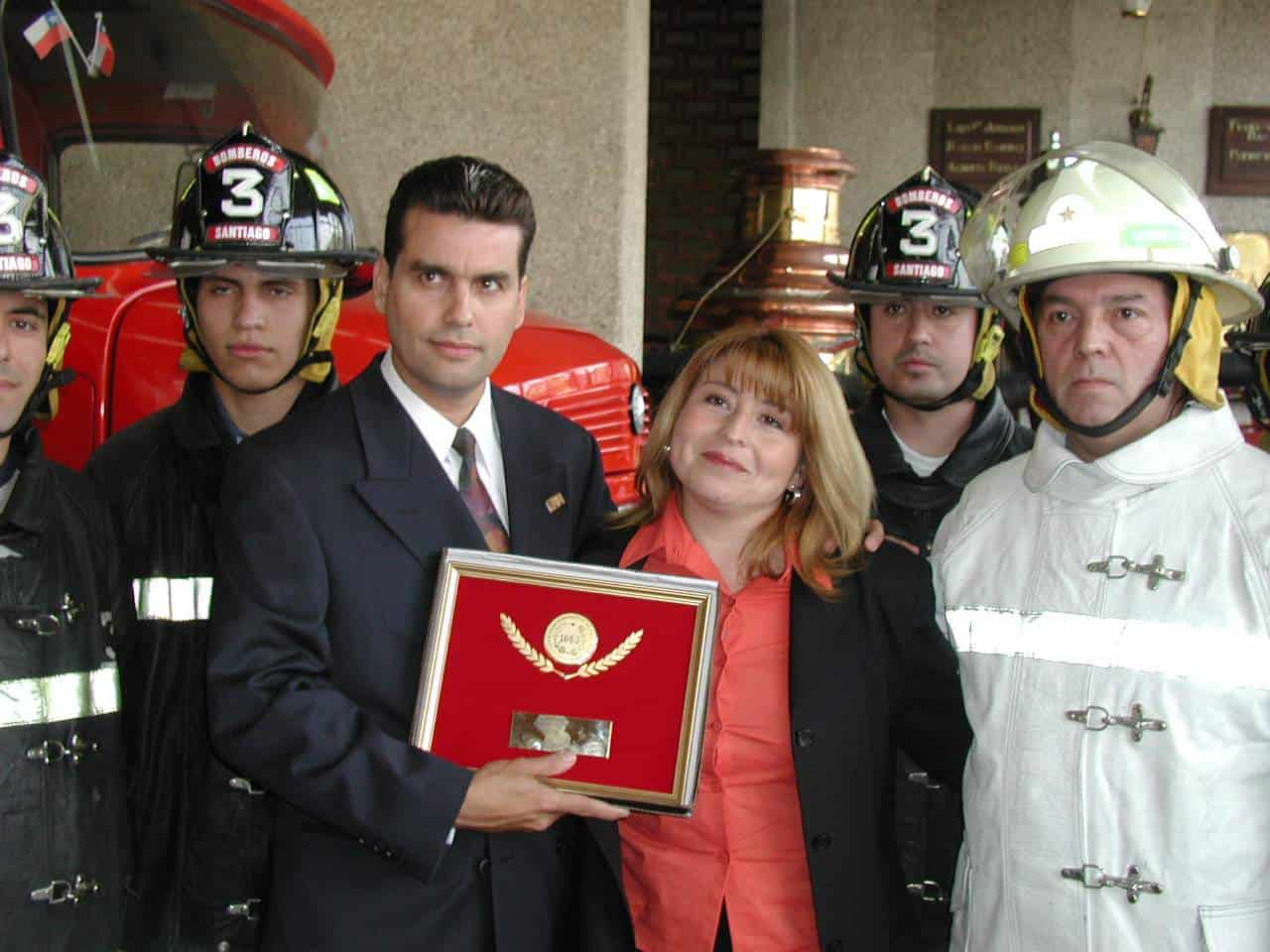 William Rodríguez, a 9/11 survivor who helped people escape the World Trade Center’s North Tower, receives recognition during a ceremony with firefighters in Santiago, Chile.